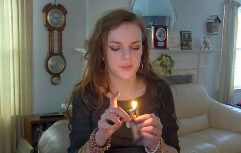 Woman lighting up crack